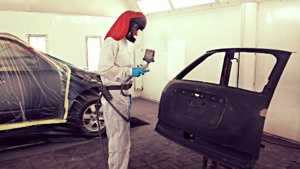 MCP Collision & Glass painter in the downdraft spray booth, Annandale MN